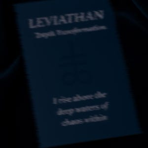 May include: A dark blue rectangular card with the word "LEVIATHAN" in white text at the top. Below, the text reads "Depth Transformation." Further down, the card has the words "I rise above the deep waters of shore within."