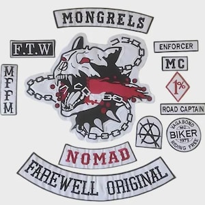 May include: A collection of embroidered patches with biker-themed designs. The patches feature text like "MONGRELS", "NOMAD", and "FAREWELL ORIGINAL". A central patch depicts a snarling dog with a chain and red accents.