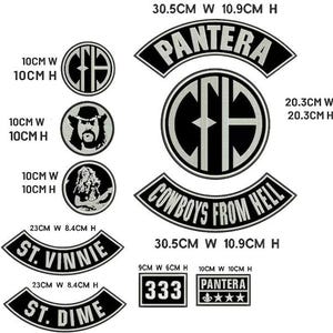 May include: A selection of black and white patches featuring text and designs. Includes patches with the text "PANTERA", "COWBOYS FROM HELL", "ST. VINNIE", and "ST. DIME". Some patches have graphic designs. Measurements are in centimetres.