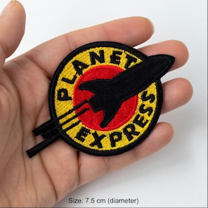 Parche bordado del cohete Planet Express: Aplicación termoadhesiva de aventura espacial