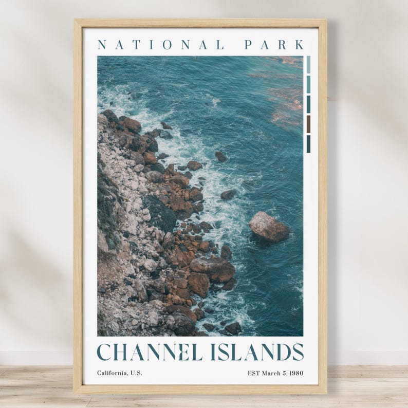 May include: A framed print depicting the Channel Islands National Park coastline. The image shows a rocky shore meeting the turquoise ocean. The text "NATIONAL PARK" and "CHANNEL ISLANDS" are displayed at the top and bottom, with location and date details.