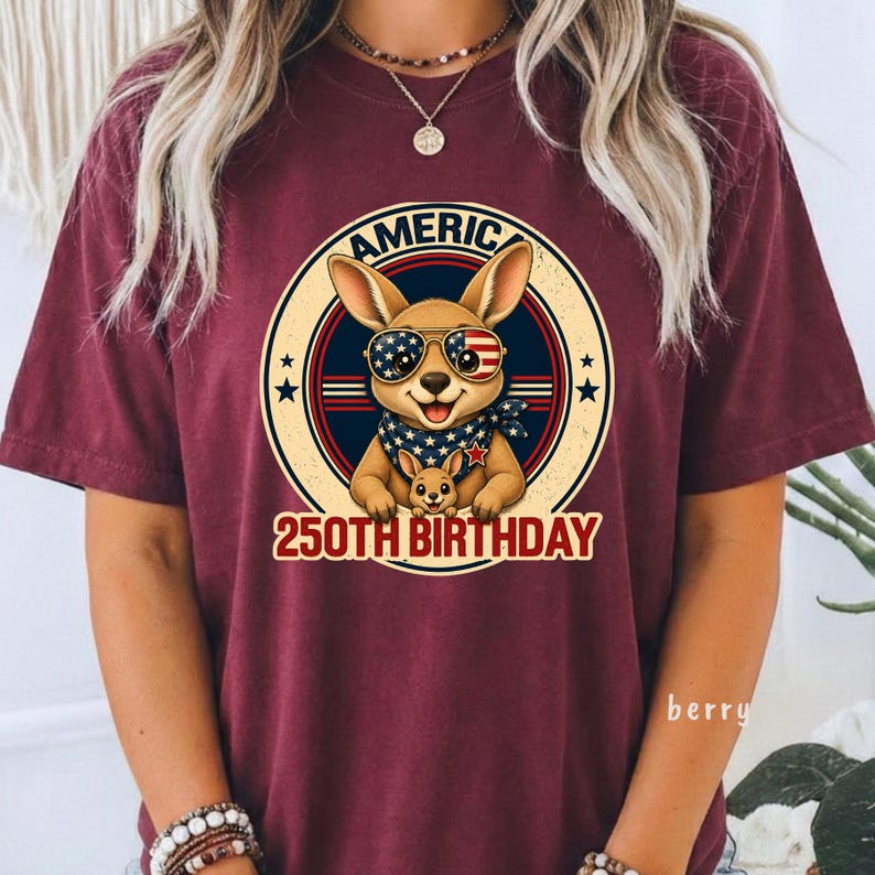 Cute patriotic kangaroo wearing American flag sunglasses shirt, America 250 shirt, funny animal tee, patriotic shirt, retro USA shirt, 4th of July shirt, vintage Americana animal graphic tee, USA 250 anniversary apparel, independence day shirt, animal graphic tee, summer patriotic outfit, funny patriotic animal shirt, freedom celebration shirt, fourth of july tee, cute kangaroo lover gift.