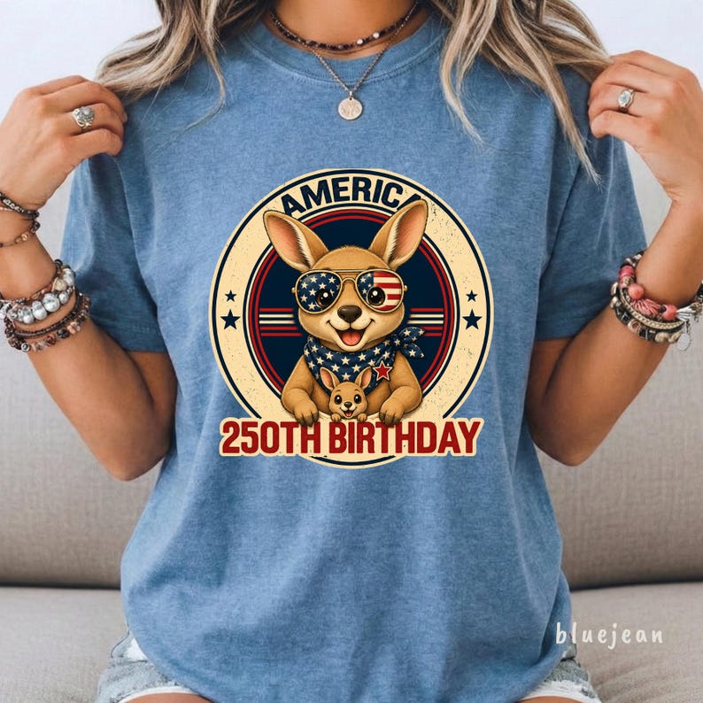 Cute patriotic kangaroo wearing American flag sunglasses shirt, America 250 shirt, funny animal tee, patriotic shirt, retro USA shirt, 4th of July shirt, vintage Americana animal graphic tee, USA 250 anniversary apparel, independence day shirt, animal graphic tee, summer patriotic outfit, funny patriotic animal shirt, freedom celebration shirt, fourth of july tee, cute kangaroo lover gift.