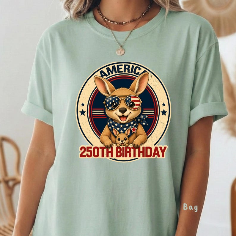 Cute patriotic kangaroo wearing American flag sunglasses shirt, America 250 shirt, funny animal tee, patriotic shirt, retro USA shirt, 4th of July shirt, vintage Americana animal graphic tee, USA 250 anniversary apparel, independence day shirt, animal graphic tee, summer patriotic outfit, funny patriotic animal shirt, freedom celebration shirt, fourth of july tee, cute kangaroo lover gift.