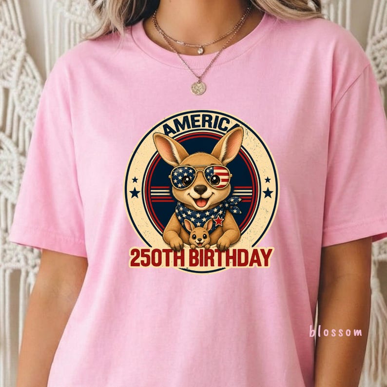 Cute patriotic kangaroo wearing American flag sunglasses shirt, America 250 shirt, funny animal tee, patriotic shirt, retro USA shirt, 4th of July shirt, vintage Americana animal graphic tee, USA 250 anniversary apparel, independence day shirt, animal graphic tee, summer patriotic outfit, funny patriotic animal shirt, freedom celebration shirt, fourth of july tee, cute kangaroo lover gift.