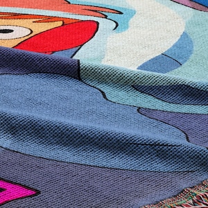 a close-up view of a colorful, textured fabric with a cartoon character design.