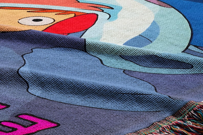 a close-up view of a colorful, textured fabric with a cartoon character design.