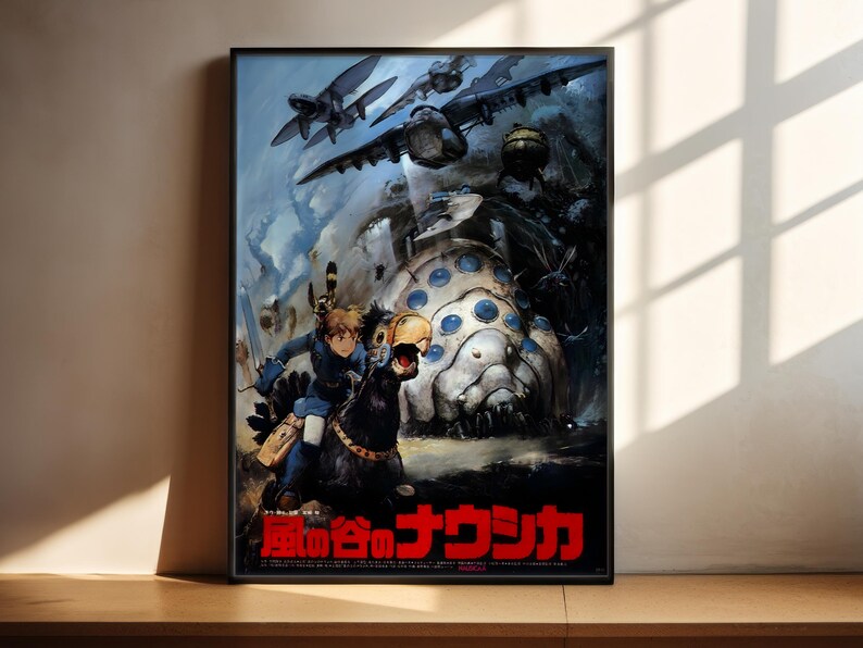 The image is a poster featuring a character riding a horse, surrounded by various fantastical creatures and elements, including a large, circular object. The poster has a predominantly dark and moody color scheme, with the character and the central object being the most prominent features. The text on the poster is in Japanese, which suggests that it is likely an anime or other Japanese-language media.
