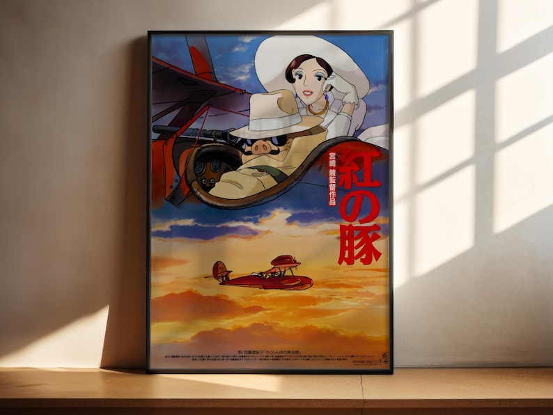 The image is a poster featuring an animated scene with a woman and a red airplane flying in the sky. The poster has a predominantly blue and orange color scheme, with the woman wearing a white hat and the airplane having a red tail. The poster also includes Japanese text, which translates to "The image depicts a red airplane flying in the sky".