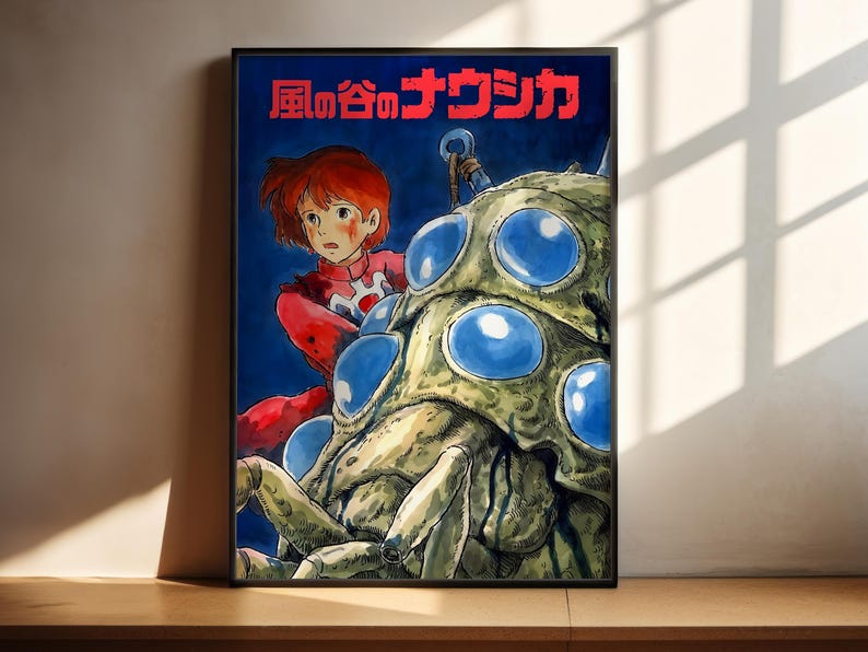 The image is a poster featuring an illustration of a young girl with red hair, wearing a red outfit, standing next to a large, colorful creature with blue eyes. The creature appears to be a large, green or brown insect or spider. The poster has Japanese text at the top, which translates to "The image depicts" or "The image shows".