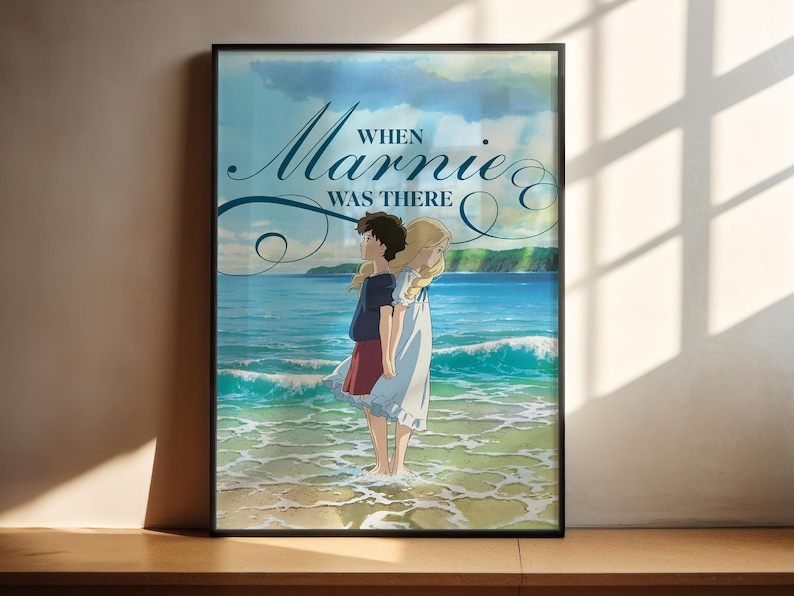 The image is a poster featuring an illustration of two people standing on a beach, with the ocean in the background. The text on the poster reads "When Marnie was there".