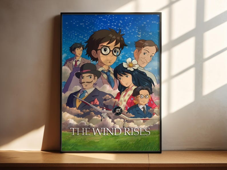 The image is a poster for the animated film "The Wind Rises". It features a group of characters from the film, including a young boy with glasses, a man in a top hat, and several other individuals, all set against a backdrop of a starry sky.