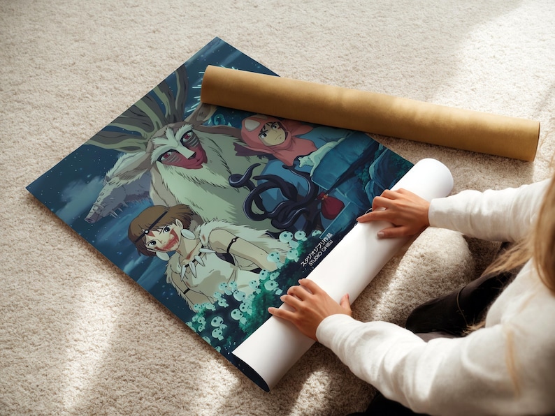 A person is holding a rolled-up poster with an illustration of characters from an anime or manga series.