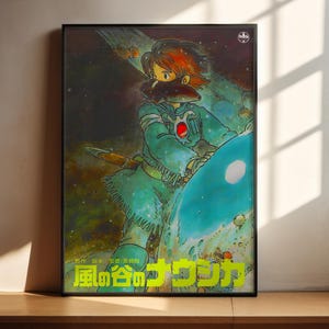 The image is a framed poster featuring an illustration of a character with a distinctive hairstyle and facial features, set against a colorful, cosmic background.