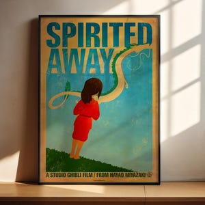 The image is a poster for the Studio Ghibli film " Spirited Away". It features an illustration of a young girl in a red dress standing on a grassy hill, with a large dragon-like creature in the background.