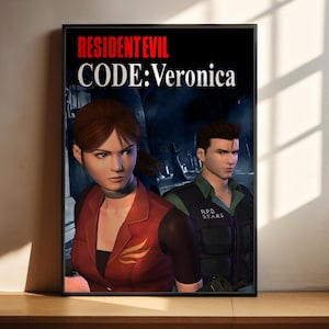May include: A framed poster for the video game "Resident Evil Code: Veronica." The image shows two characters with stern expressions set against a dark backdrop. The game's title is displayed in white and red text at the top of the poster.