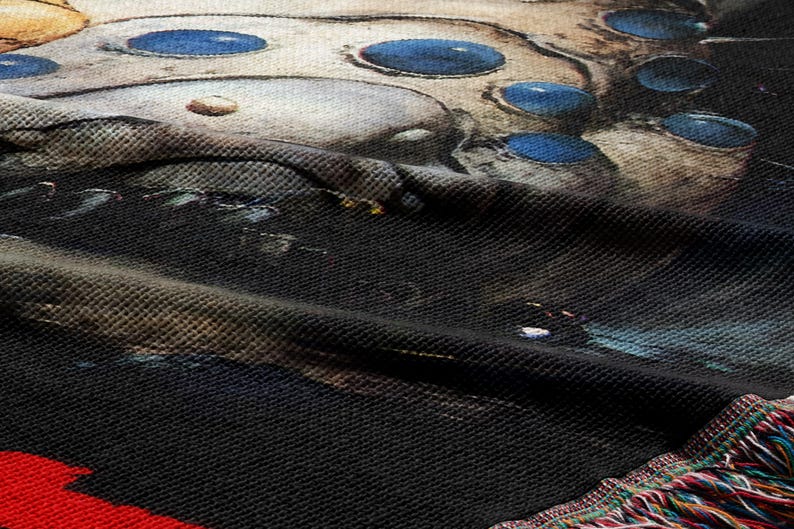 a close-up view of a textured fabric with a striking pattern of blue circles and a dark background.