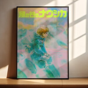 The image is a framed poster featuring an illustration of a person in a blue jacket, with a colorful background.