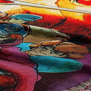 The image is a vibrant and colorful textile featuring a variety of cartoon-style characters and designs, including a character with a blue hat and a character with a red hat. The overall composition is visually engaging and dynamic, with a mix of warm and cool colors that create a lively and energetic atmosphere.