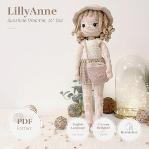 May include: A 14-inch crochet doll named LillyAnne Sunshine Dreamer wearing a cream-colored hat, a white sleeveless top, and a beige skirt with a matching crossbody bag. The doll has curly blonde hair, black eyes, and a light skin tone.