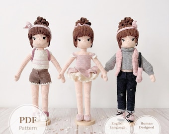 May include: Three handmade crochet dolls with brown yarn hair styled in buns. The left doll wears a white top, brown shorts, and a pink headband. The center doll wears a pink ballet dress. The right doll wears a gray sweater, pink vest, and dark pants.