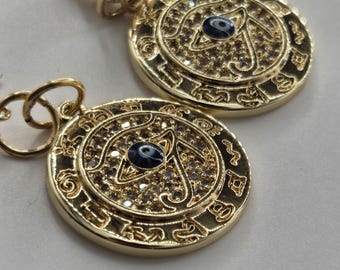 Orecchini a cerchio con occhio di Horus in argento sterling