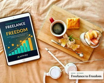 May include: A tablet displaying an ebook cover titled Freelance to Freedom with a graphic of a rising bar chart, next to a wooden board with a cup of black coffee, a pastry, a glass of fruit, a flower, a spoon, a stylus, and white headphones.