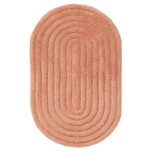 May include: An oval-shaped bath mat in a solid terracotta colour. The rug features a textured surface with concentric oval ridges that follow the outer shape, creating a repeating pattern of raised lines across the entire surface of the mat.