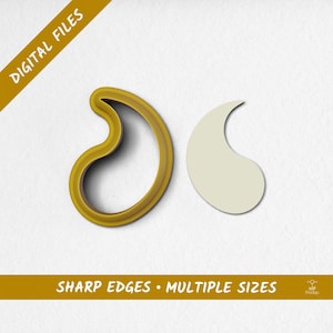 Peut inclure: Un emporte-pièce jaune en forme de paisley et une découpe en forme de paisley sont présentés sur fond blanc. Le texte "DIGITAL FILES" et "SHARP EDGES • MULTIPLE SIZES" sont imprimés sur l'image.