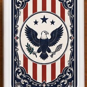May include: A white rectangular box with a patriotic design. The design features red and white stripes, a circular emblem with an eagle, stars, and a blue border with decorative elements. The overall theme is Americana.