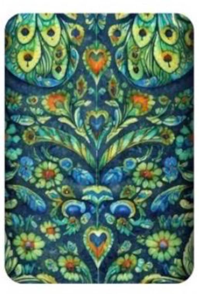 May include: A rectangular, patterned design featuring a symmetrical arrangement of floral and peacock feather motifs. The design incorporates a rich color palette of blues, greens, yellows, and oranges, creating a vibrant and detailed visual texture. The overall aesthetic is reminiscent of vintage textiles.