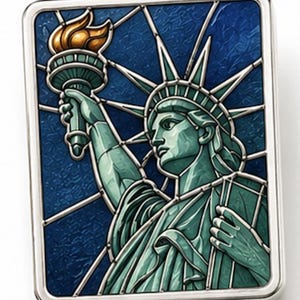 May include: A rectangular silver-framed image of the Statue of Liberty in a stained-glass style. The statue is teal with a golden torch against a blue background. The design features a starburst pattern and is a detailed illustration.