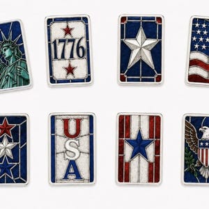 May include: A collection of rectangular, patriotic-themed metal pins. Designs include the Statue of Liberty, the number 1776, a white star on a blue background, and the American flag. Other pins feature the word "USA" and an eagle.