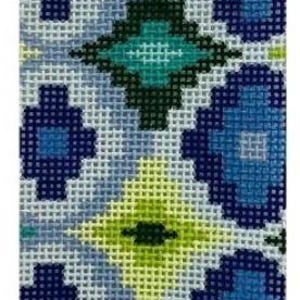 May include: A rectangular needlepoint design featuring a repeating geometric pattern. The pattern includes diamond and floral shapes in shades of blue, green, and yellow on a light blue background. The needlepoint has a textured appearance.