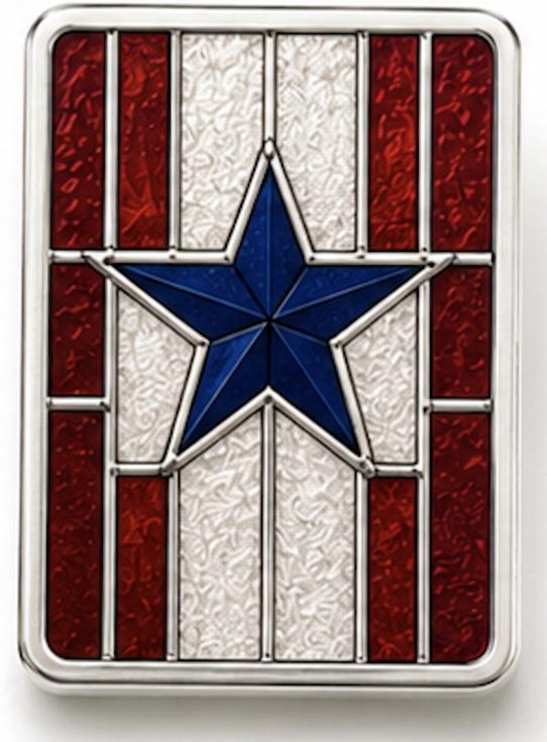 May include: A rectangular decorative item with a patriotic theme. It has a blue star at the centre, with red and white sections, all within a silver frame. The design is reminiscent of a stained-glass window.