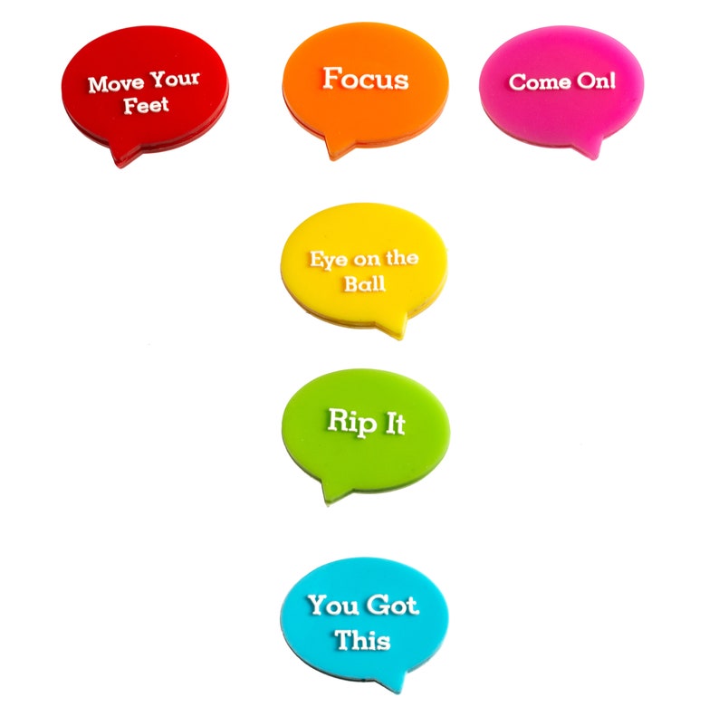 May include: Six colorful speech bubble-shaped motivational signs with white text. The signs read "Move Your Feet", "Focus", "Come Onl", "Eye on the Ball", "Rip It", and "You Got This".