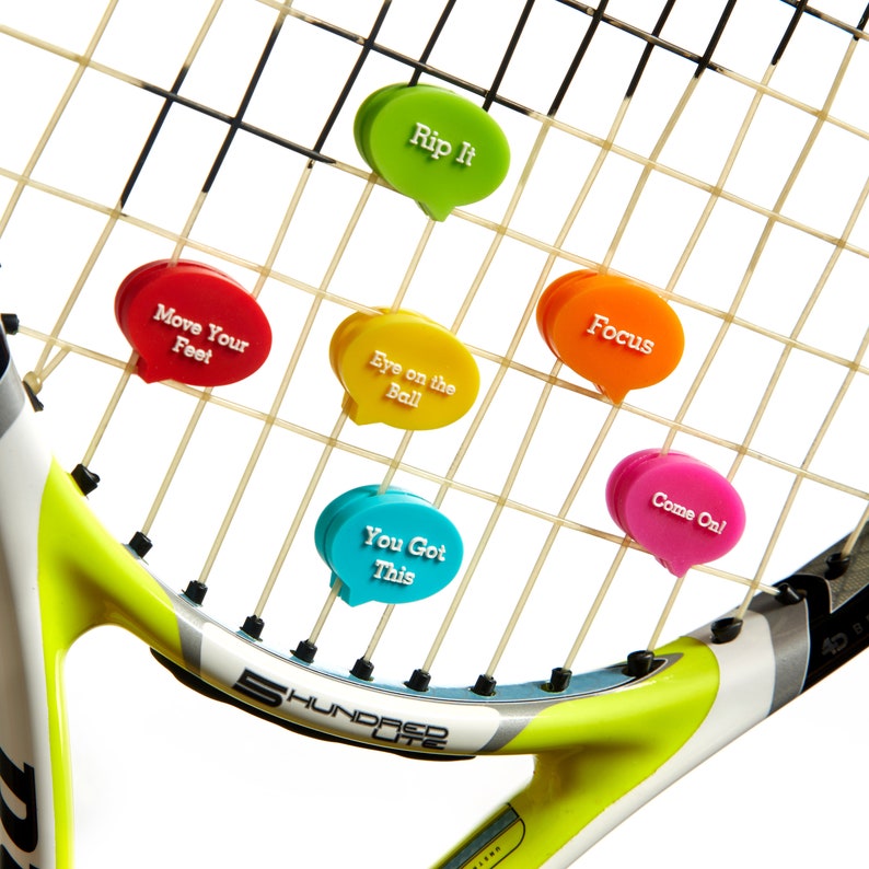 May include: A tennis racket with colorful motivational phrases attached to the strings. The phrases include "Rip It", "Move Your Feet", "Eye on the Ball", "You Got This", "Focus", and "Come On!"
