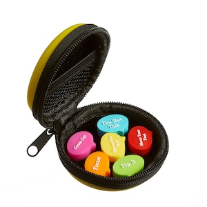 May include: A yellow zippered case with six colorful motivational message speech bubbles inside. The messages are "Come On!", "Focus", "You Got This", "Bye on the Ball", "Rip It", and "Move Your Feet".