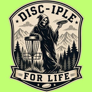 May include: A black and white graphic sticker featuring a hooded skeleton leaning on a disc golf basket. The skeleton holds a disc in one hand. The background shows mountains and pine trees. The text reads DISC-IPLE at the top and FOR LIFE at the bottom.