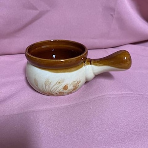 May include: A rustic wooden sign with the text "Welcome to our home" in white lettering. The sign features a distressed finish and a simple, inviting design, perfect for entryway decor.