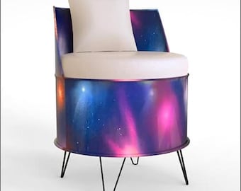 May include: A unique chair with a cylindrical base featuring a vibrant galaxy design in shades of blue, purple, and pink. It has a white seat cushion and backrest, and black hairpin legs. A white square pillow rests on the backrest.