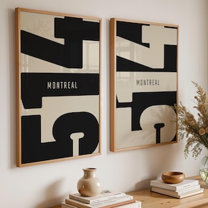 May include: A white ceramic mug with a black handle and the text "But First, Coffee" in a black, bold font. The mug is on a white surface.