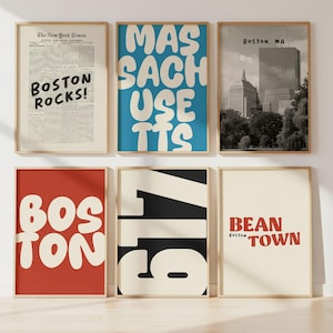 May include: Six framed art prints with a Boston theme. The prints feature text like "Boston Rocks!", "Massachusetts", "Boston, MA", "Boston", "617", and "Bean Town". The color palette includes red, blue, black, and cream.