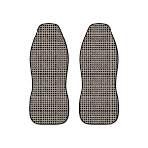 May include: Two car seat covers with a houndstooth pattern in black and beige. The covers have a black border and are designed to fit over the front seats of a vehicle. The pattern is a classic, timeless design.