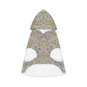 May include: A hooded pet towel with a detailed paisley pattern in gold, white, and brown. The towel has a white trim and two white pockets. The hood is at the top of the towel.