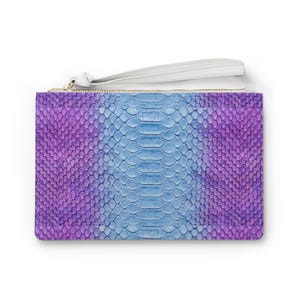 May include: A rectangular clutch bag with a snakeskin pattern in purple and blue hues. It features a white wrist strap and a gold zip. The colour scheme is symmetrical, transitioning from purple to blue across the surface.