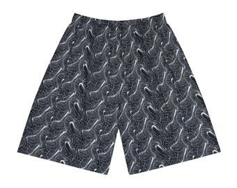 May include: Black and white patterned shorts. The shorts feature a repeating abstract design of swirling lines. The shorts have an elastic waistband and a relaxed fit. The fabric appears to be lightweight and suitable for warm weather.