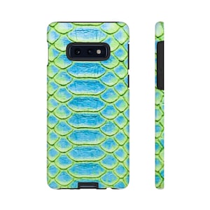 May include: A smartphone case with a vibrant snakeskin pattern in shades of blue and green. The case features a textured design that mimics the scales of a snake. The phone case is shown from the front and side, highlighting its protective design.