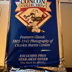 May include: Sealed Conlon Collection trading card pack. The blue and silver foil pack features the Conlon Collection logo, a diamond-shaped graphic with a sepia-toned image, and text that reads "Features Classic 1905-1942 Photography of Charles Martin Conlon."