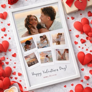 May include: A white framed photo collage with six pictures of a couple, surrounded by red paper hearts, a red rose, and a gift box with a red bow. The text "Happy Valentines Day!" is printed on the frame.